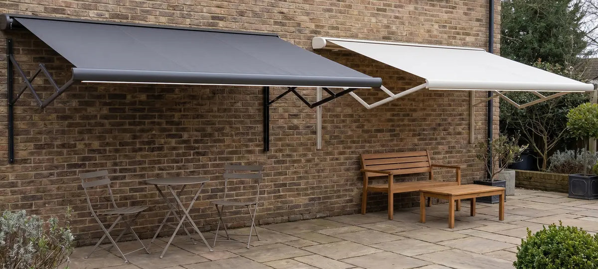 Anthracite grey and white retractable patio awnings with LED lighting