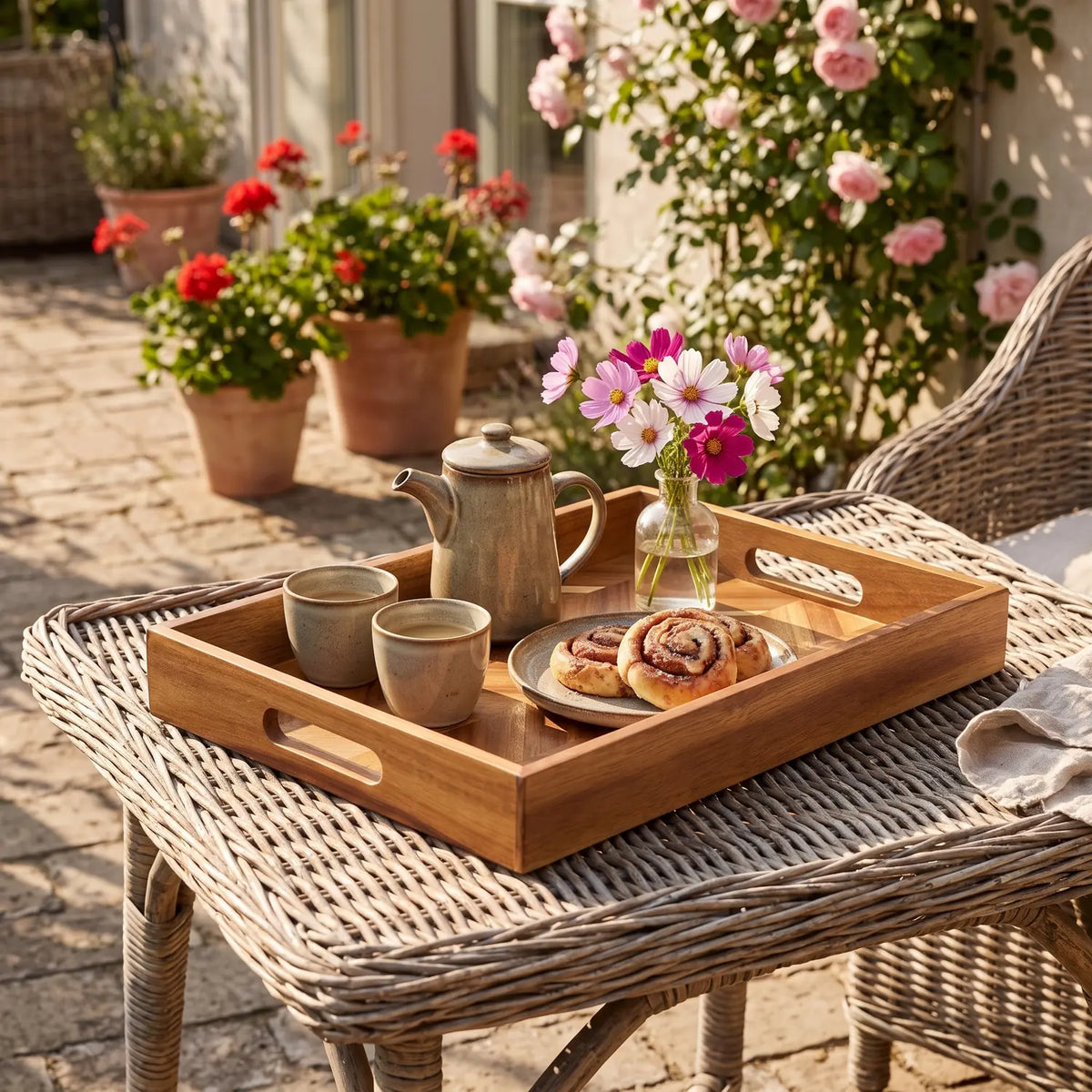 Acacia Wood Tray with Handles, Herringbone, carrying coffee and cinnamon buns on a wicker garden table